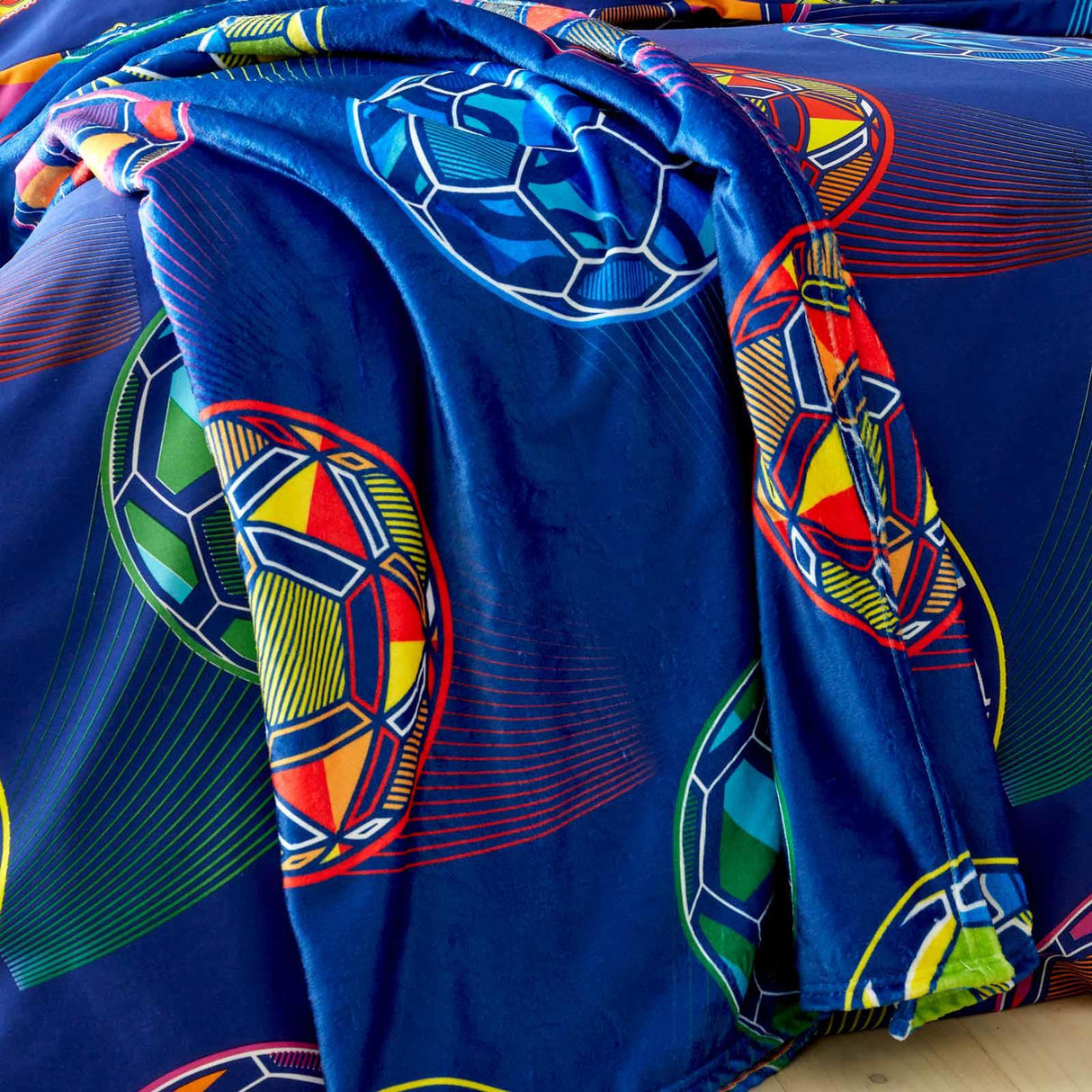 Bright Football Throw by Catherine Lansfield