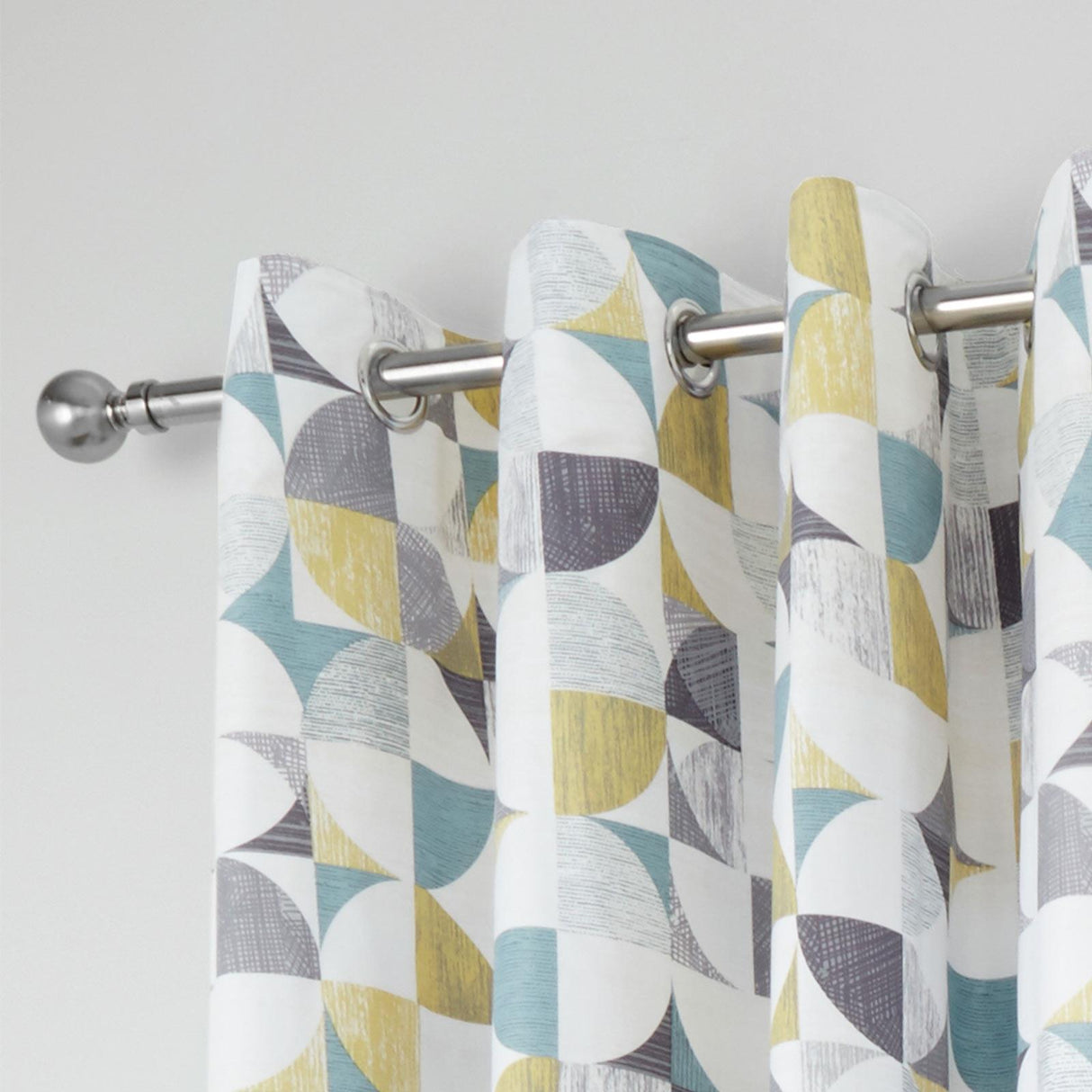 Retro Circles Eyelet Curtains by Catherine Lansfield