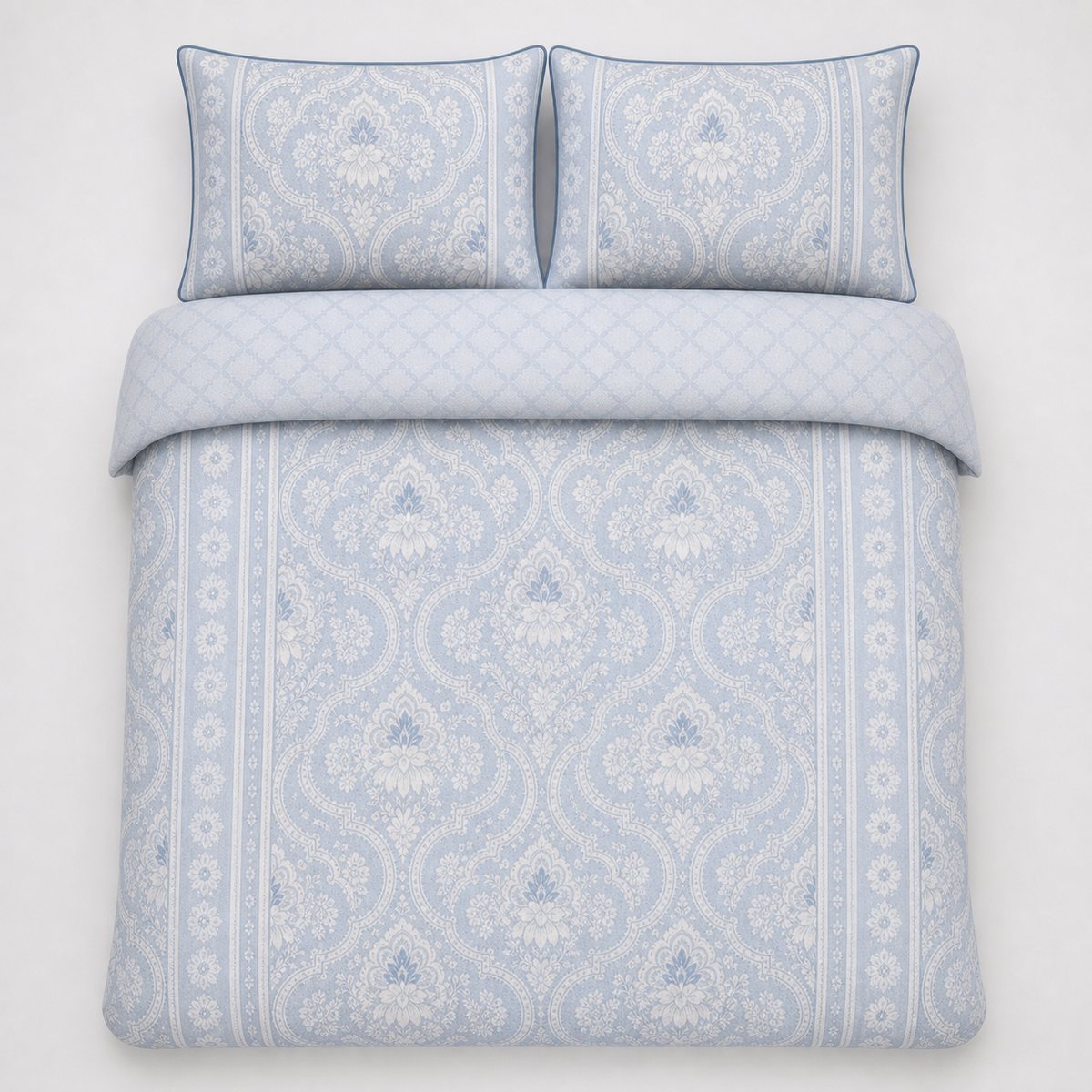 Overhead flat lay of the Alexia Blue Floral Cotton Duvet Cover Set with two matching pillowcases