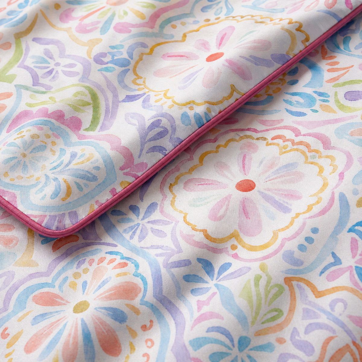 Macro close-up of the Casablanca smooth cotton duvet cover fabric with pastel paisley detail