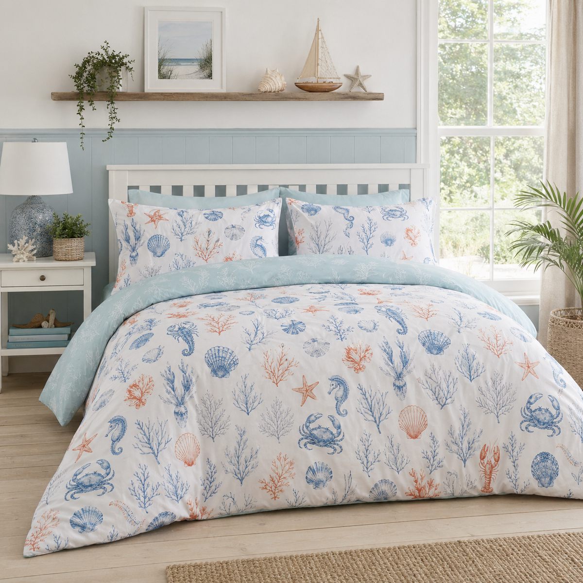 Coastal Bay coral and blue sea life duvet cover set styled on a fresh coastal bedroom bed