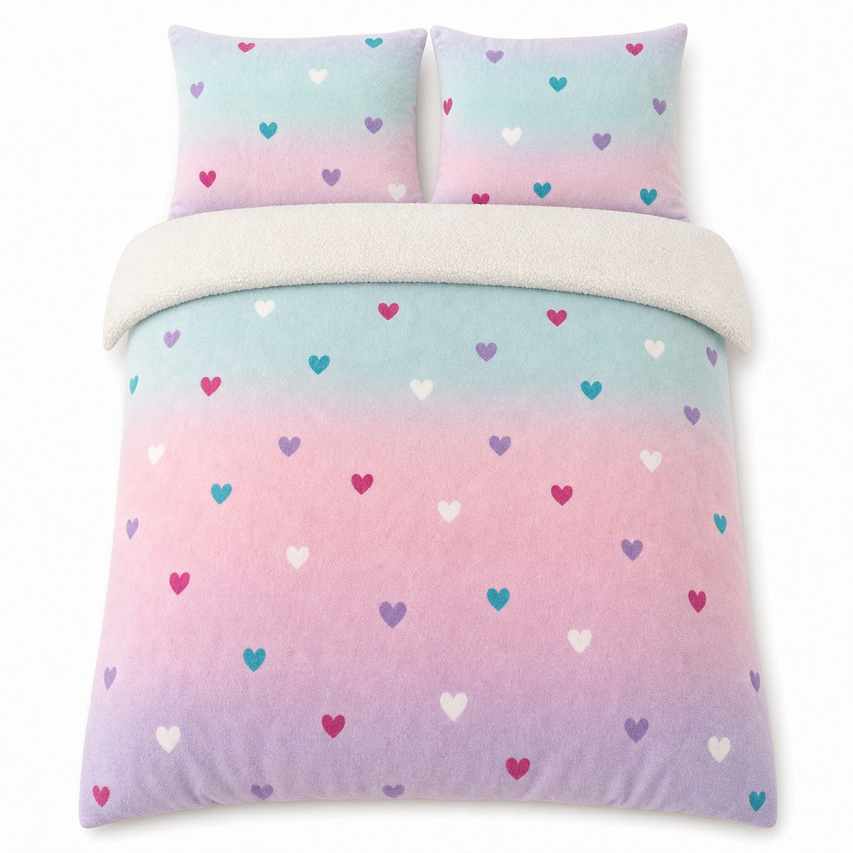 Overhead flat lay of the Cosy Ombre Heart Kids Duvet Cover Set with two matching pillowcases