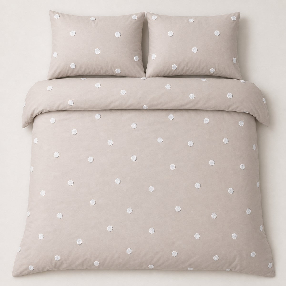 Overhead flat lay of the Dot Garden Cotton Duvet Cover Set in linen with two matching pillowcases