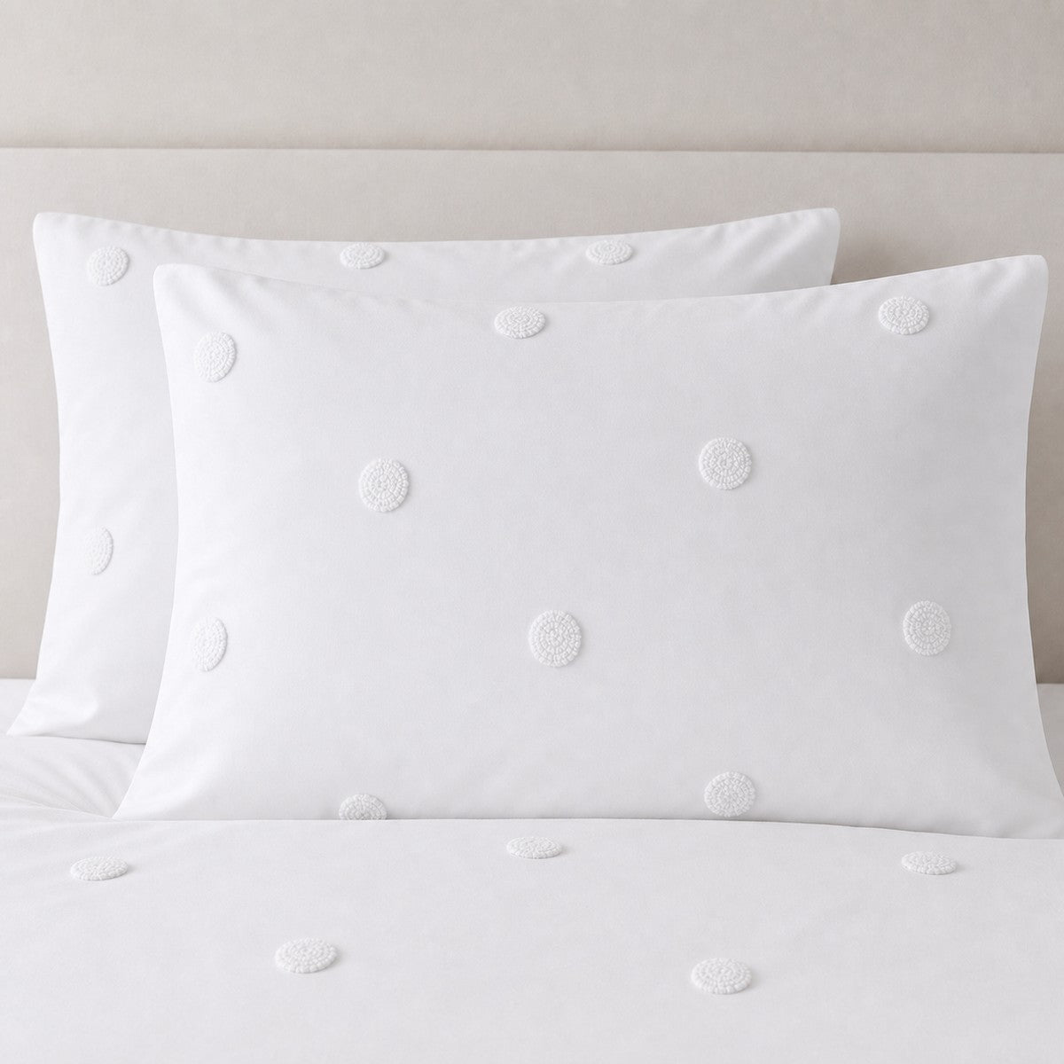 Close-up of Dot Garden Cotton Duvet Cover Set in white pillowcases showing the print and fabric detail