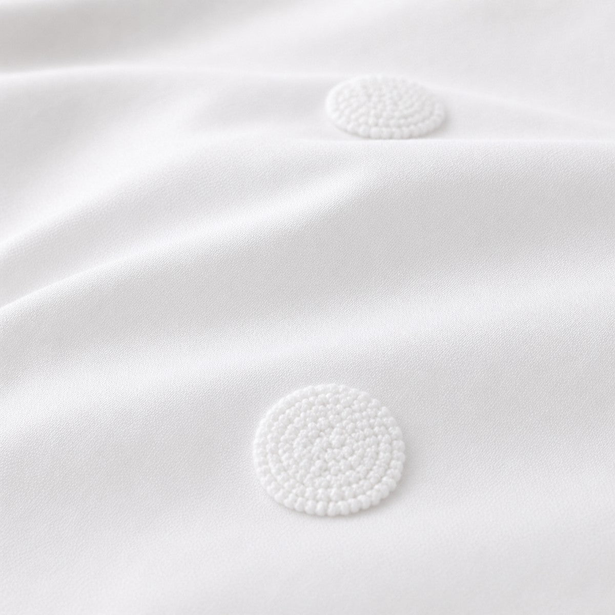 Macro close-up of the white fabric on the Dot Garden Cotton Duvet Cover Set