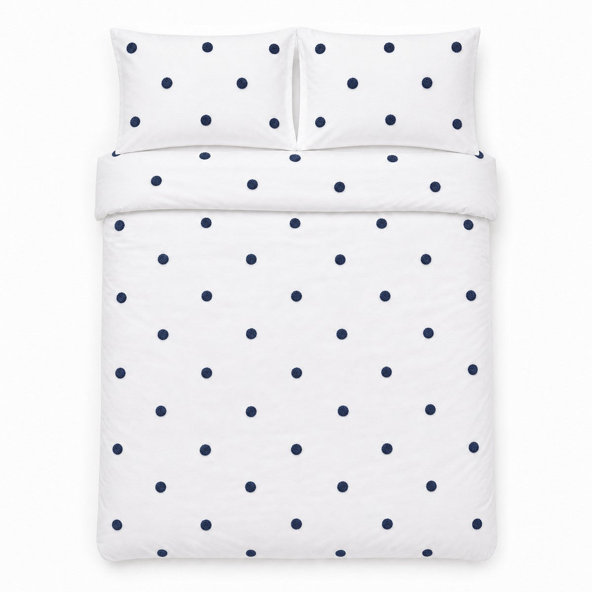 Overhead flat lay of the Dot Garden Cotton Duvet Cover Set in white + navy with two matching pillowcases