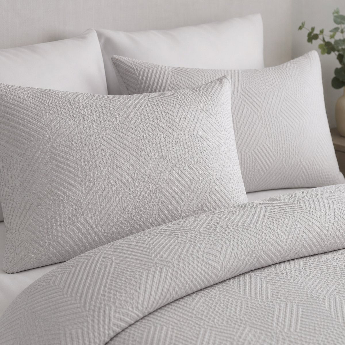 Close-up of Embossed Geo Microfibre Duvet Cover Set in grey pillowcases showing the print and fabric detail