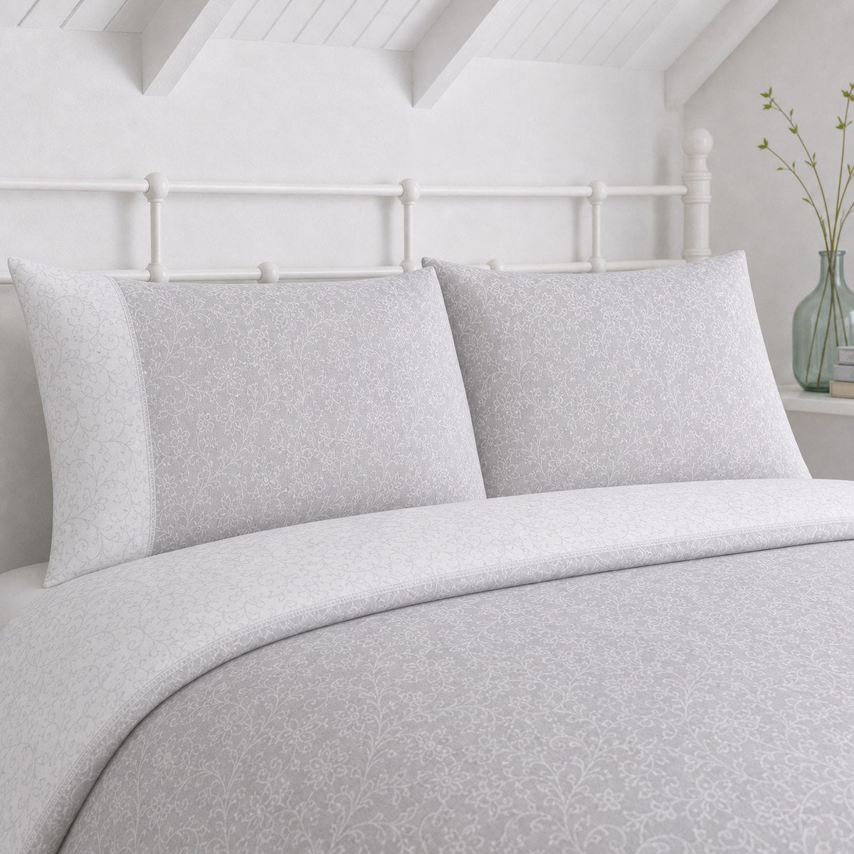 Close-up of Frampton Floral Polycotton Duvet Cover Set in grey pillowcases showing the print and fabric detail