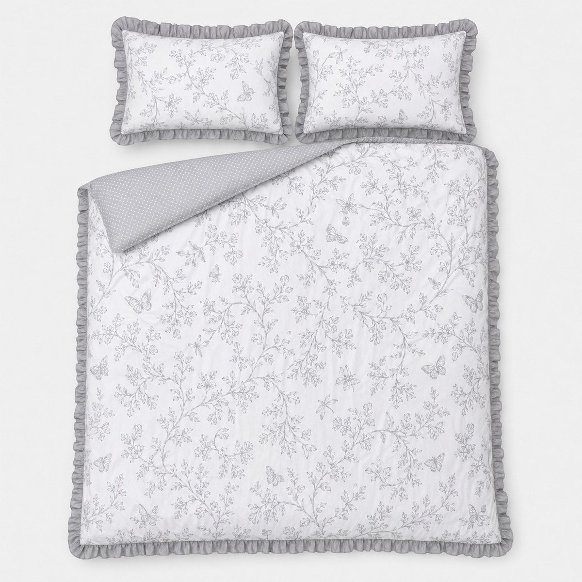 Overhead flat lay of the Kristen grey frill duvet cover set with two matching pillows