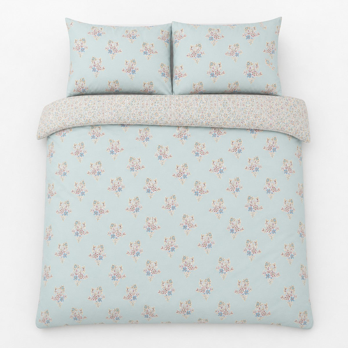 Overhead flat lay of the Lorena Patchwork Floral Duck Egg Polycotton Duvet Cover Set with two matching pillowcases