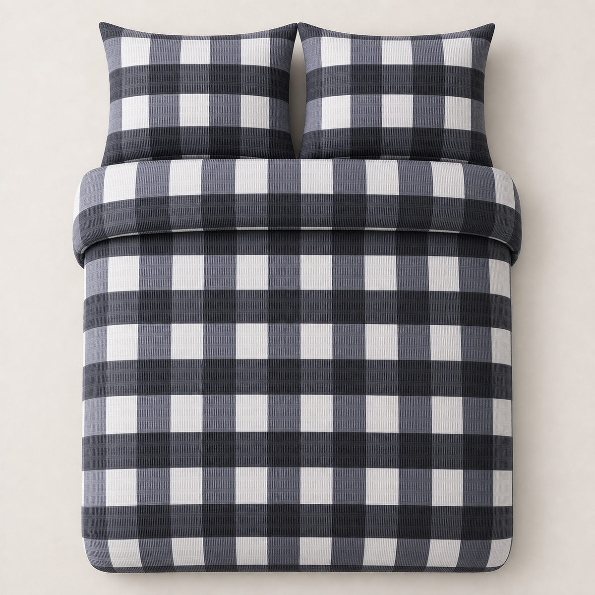 Overhead flat lay of the Seersucker Gingham charcoal duvet cover set with two matching pillowcases