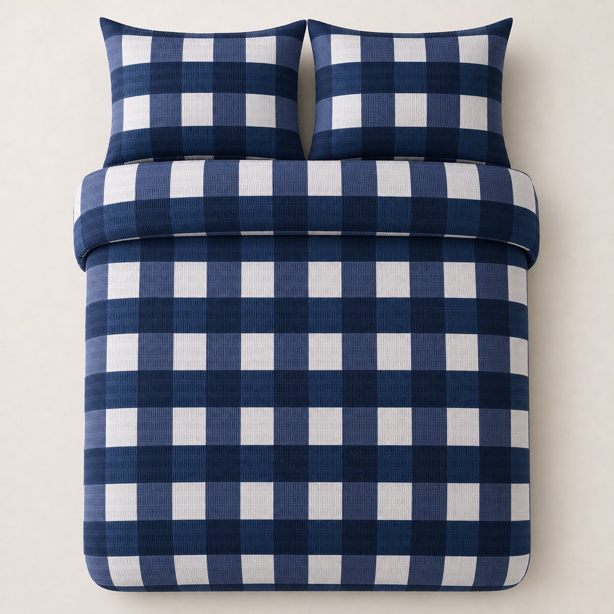 Overhead flat lay of the Seersucker Gingham navy duvet cover set with two matching pillowcases