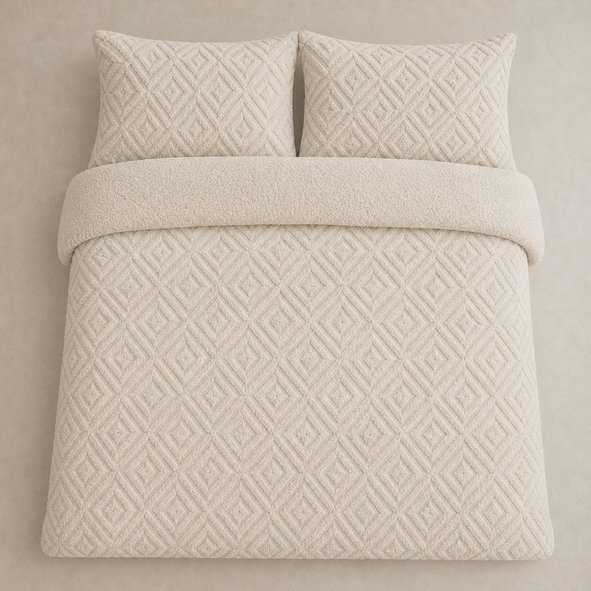 Overhead flat lay of the natural Romo fleece duvet cover set with two matching pillowcases