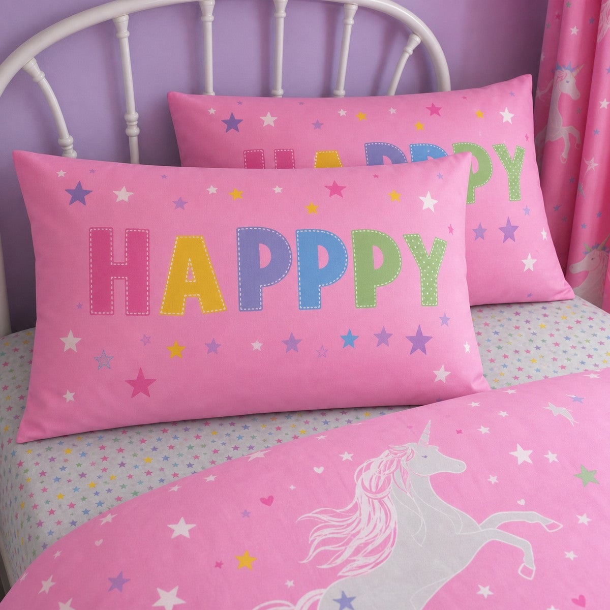 Close-up of matching Unicorn Glow In The Dark Kids Duvet Cover Set pillowcases showing the pattern and fabric detail