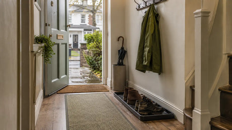 British hallway with flat mats, boot tray and clear wet-weather route