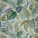 Patterned fabric with green and blue leaves on a beige background