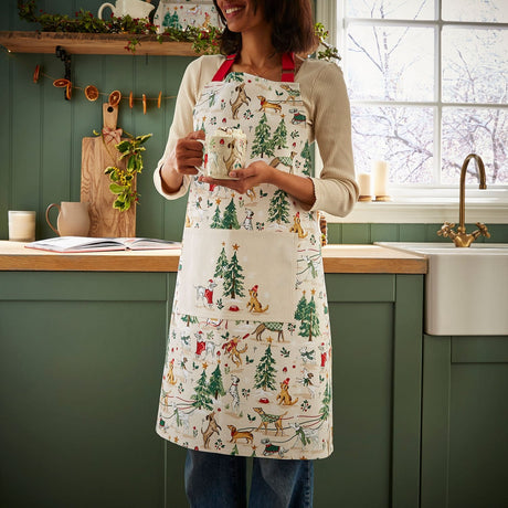 Ulster Weavers Winter Walkies Dog Print Christmas Cotton Apron - Winter Walkies Cotton Apron In Beige 2