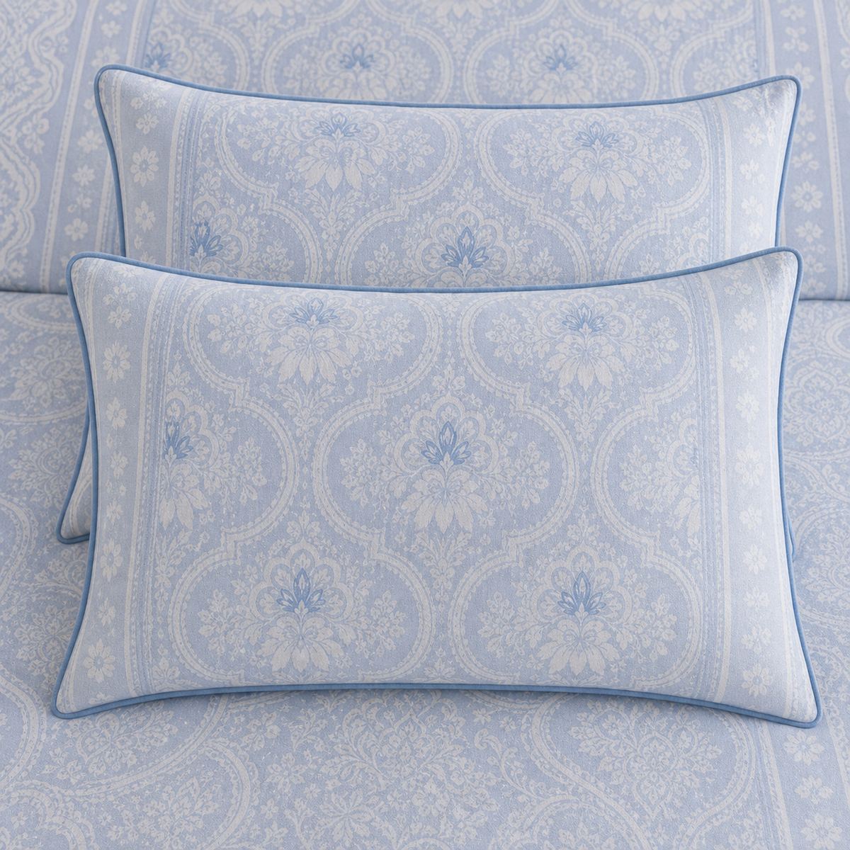 Close-up of matching Alexia Blue Floral Cotton Duvet Cover Set pillowcases showing the pattern and fabric detail