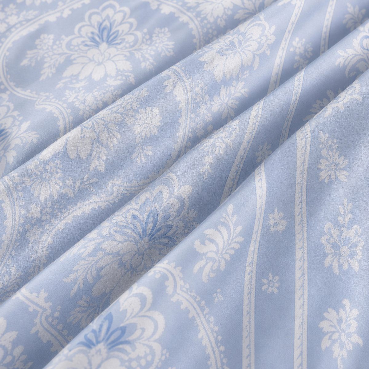 Macro close-up of the cotton sateen fabric on the Alexia Blue Floral Cotton Duvet Cover Set