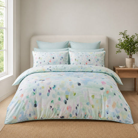 Alfresco duck egg multicolour cotton duvet cover set styled on a bright bedroom bed