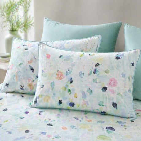Close-up of Alfresco duck egg multicolour pillowcases with aqua piping