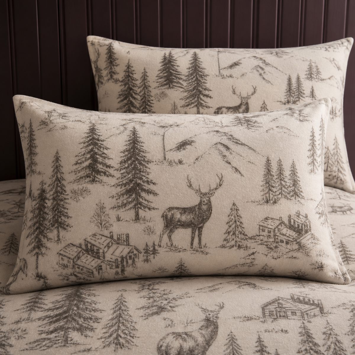 Close-up of Alpine Stag Flannelette Duvet Cover Set in natural pillowcases showing the print and fabric detail