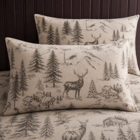 Close-up of Alpine Stag Flannelette Duvet Cover Set in natural pillowcases showing the print and fabric detail