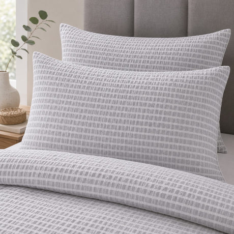 Close-up of matching Altro Seersucker Microfibre Duvet Cover Set pillowcases showing the pattern and fabric detail