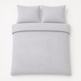 Overhead flat lay of the Altro Seersucker Microfibre Duvet Cover Set with two matching pillowcases