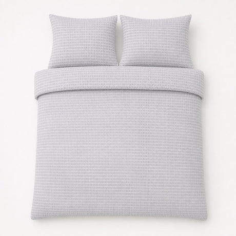 Overhead flat lay of the Altro Seersucker Microfibre Duvet Cover Set with two matching pillowcases