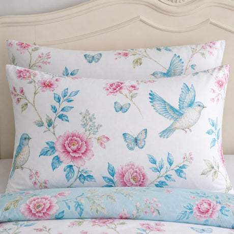Close-up of Amelle Blue floral polycotton pillowcases showing the bird and flower print