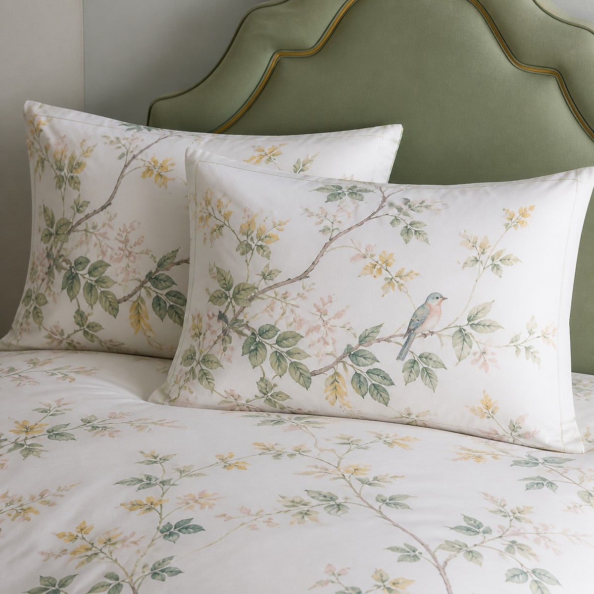 Close-up of Arianna Natural cotton pillowcases showing the bird and floral print