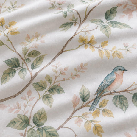 Macro close-up of Arianna Natural cotton duvet cover fabric with bird and trailing floral detail