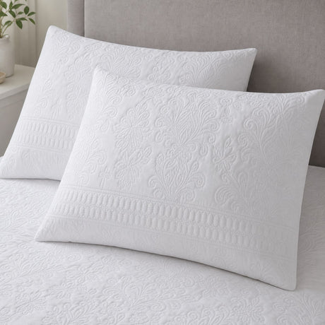 Close-up of Avery Stripe White pillowcases showing the raised floral and stripe texture