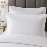 Close-up of matching Baratta 100% Cotton White Duvet Cover Set pillowcases showing the pattern and fabric detail