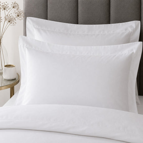 Close-up of matching Baratta 100% Cotton White Duvet Cover Set pillowcases showing the pattern and fabric detail