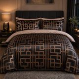 Bardon charcoal and bronze Greek key jacquard duvet cover set styled in a warm bedroom