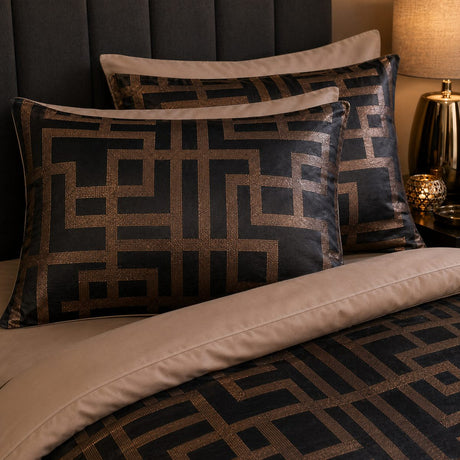 Close-up of Bardon jacquard pillowcases with bronze geometric Greek key pattern