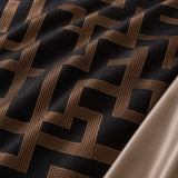 Macro close-up of Bardon microfibre jacquard fabric with raised bronze maze pattern