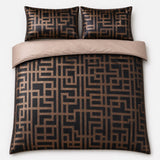 Overhead flat lay of the Bardon geometric jacquard duvet cover set with two pillows