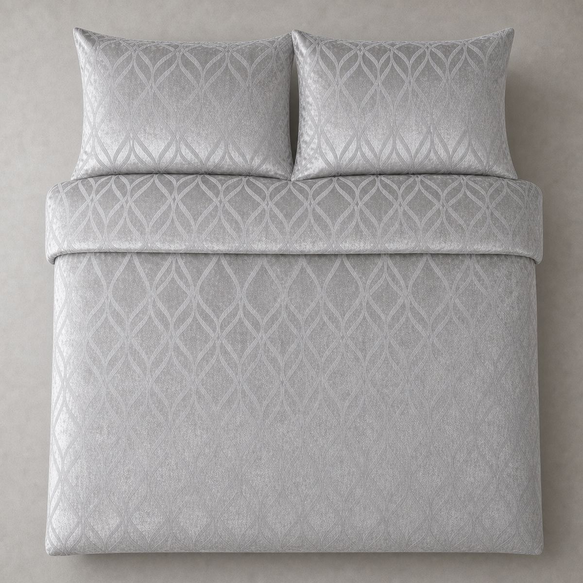 Overhead flat lay of the Belfort Velvet silver duvet cover set with two matching pillowcases