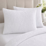 Close-up of Butterfly Garden white pillowcases showing raised embossed butterfly texture