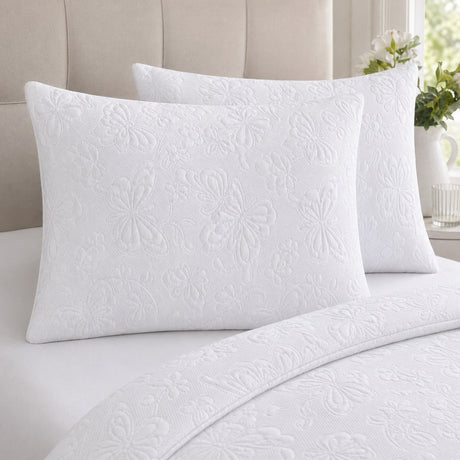 Close-up of Butterfly Garden white pillowcases showing raised embossed butterfly texture