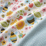 Macro close-up of the Buzzy Bee duvet cover fabric with bee garden print and polka dot reverse