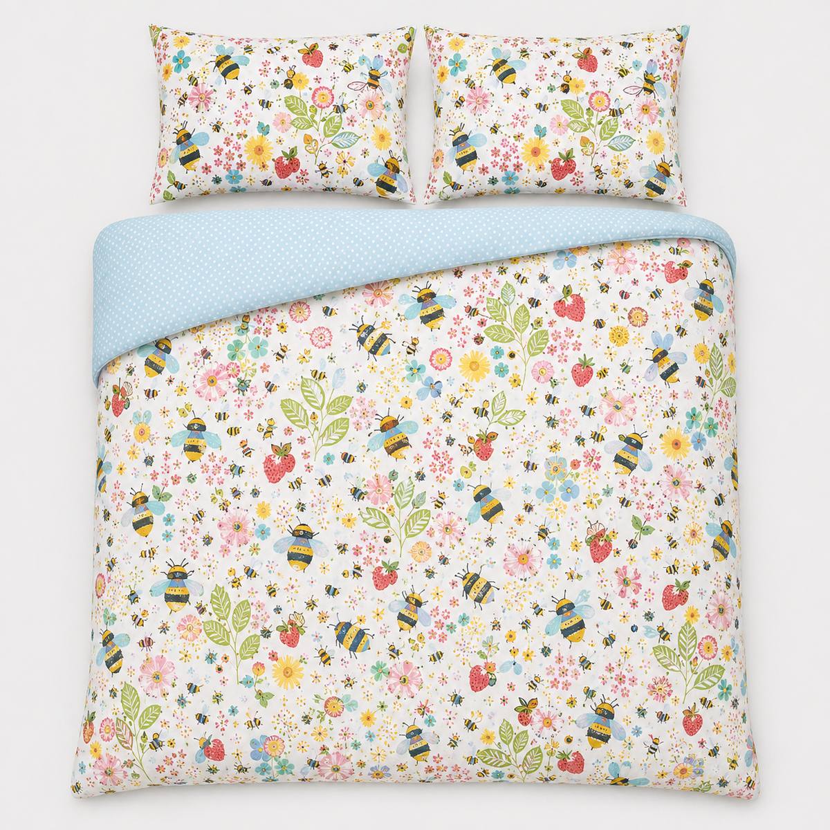 Overhead flat lay of the Buzzy Bee ochre duvet cover set with two pillows