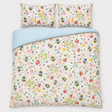 Overhead flat lay of the Buzzy Bee ochre duvet cover set with two pillows
