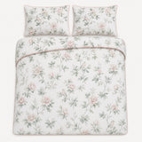 Overhead flat lay of the Campion floral cotton sateen duvet cover set with two pillows
