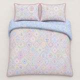 Overhead flat lay of the Casablanca multicolour cotton duvet cover set with two pillows