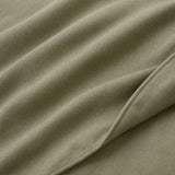 Macro close-up of Cassia Khaki cotton duvet cover fabric and subtle woven texture