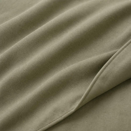 Macro close-up of Cassia Khaki cotton duvet cover fabric and subtle woven texture